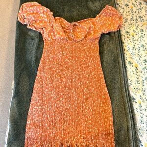 Love the runched up peach/coral shade body fitted dress.